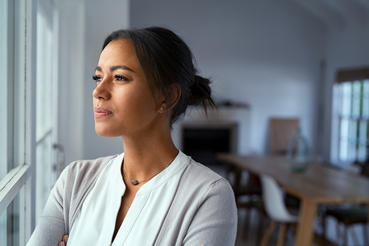 woman looking out the window