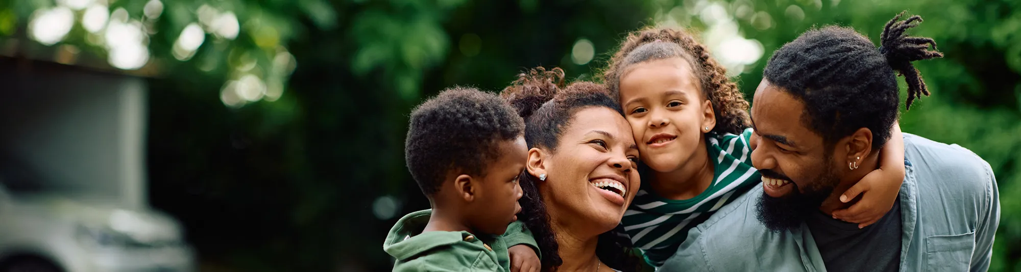 Family outside smiling